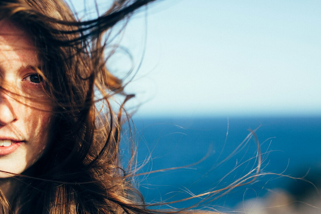 Portrait of a woman with long hair smiling