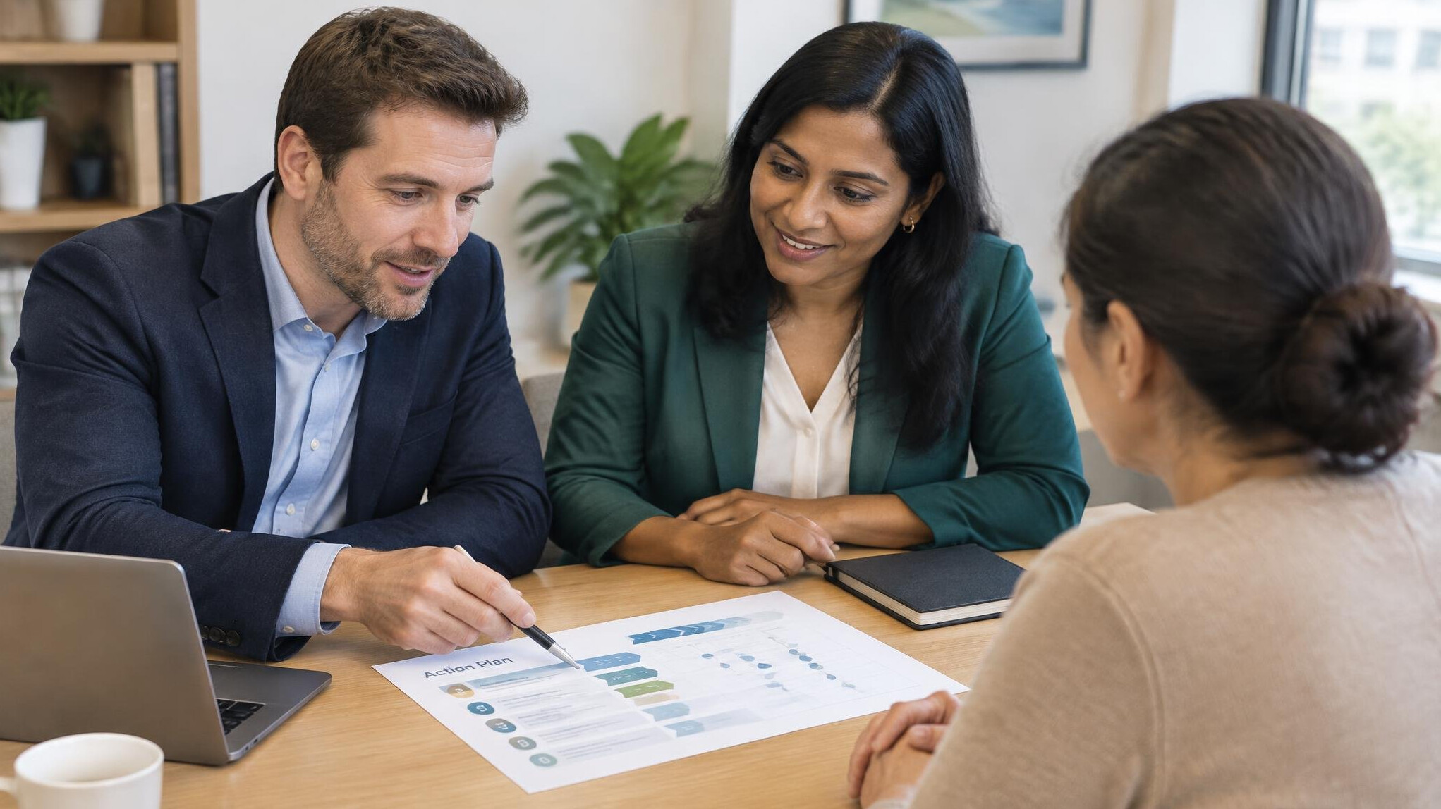 Consultants and client reviewing a plan together