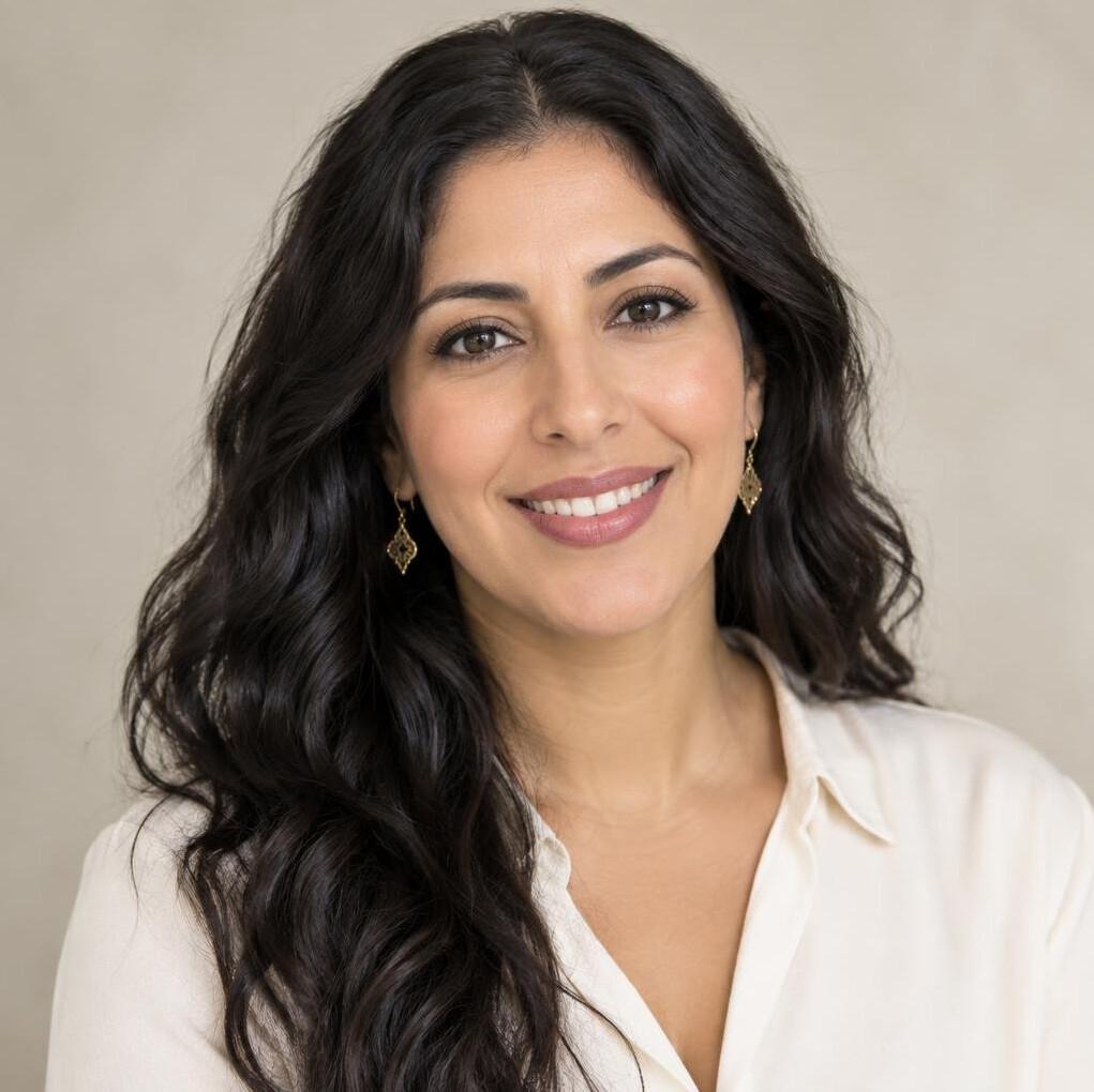 Portrait of a smiling woman with curly hair